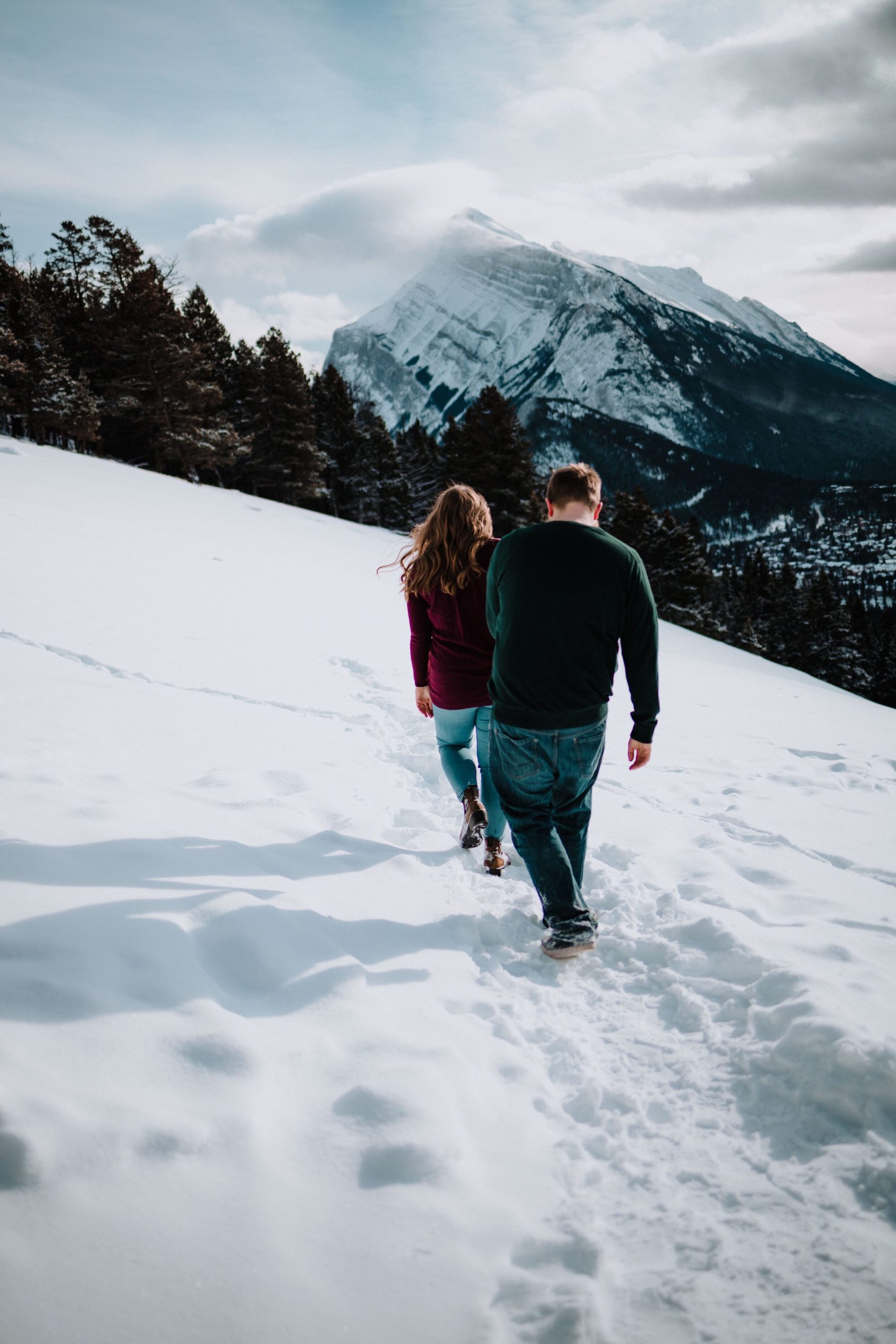 Couple walking towards the mountains