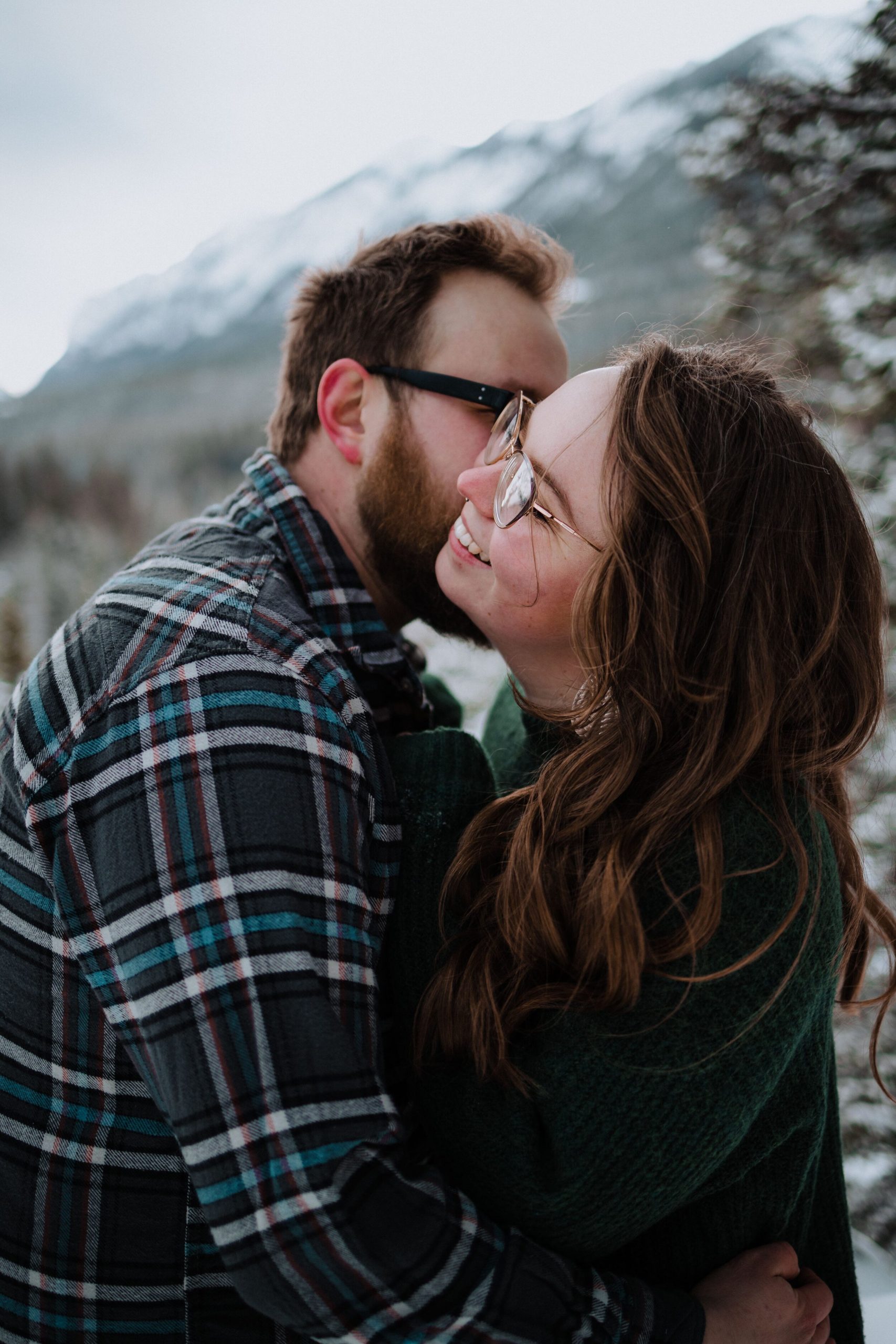 kiss on the cheek in the snow in alberta