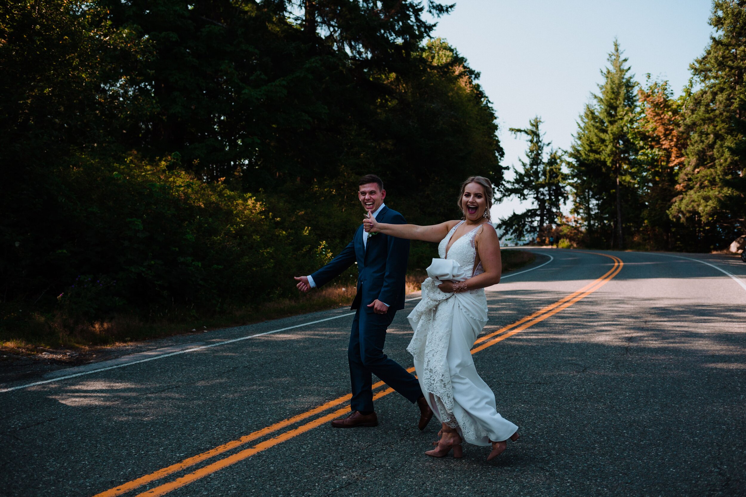 Couple hitchhiking after their wedding