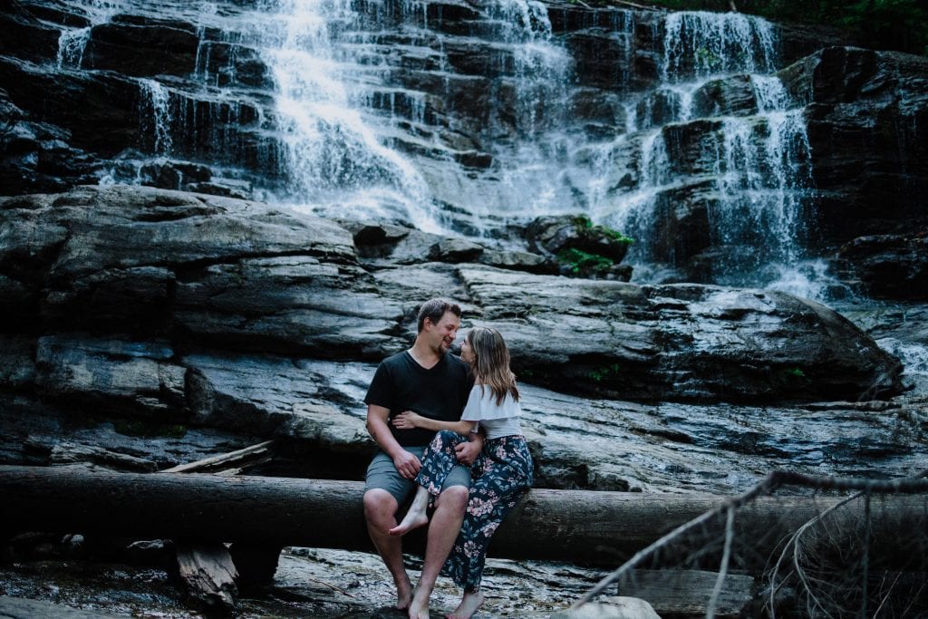 Moses falls couples photo session- sitting in front of waterfall
