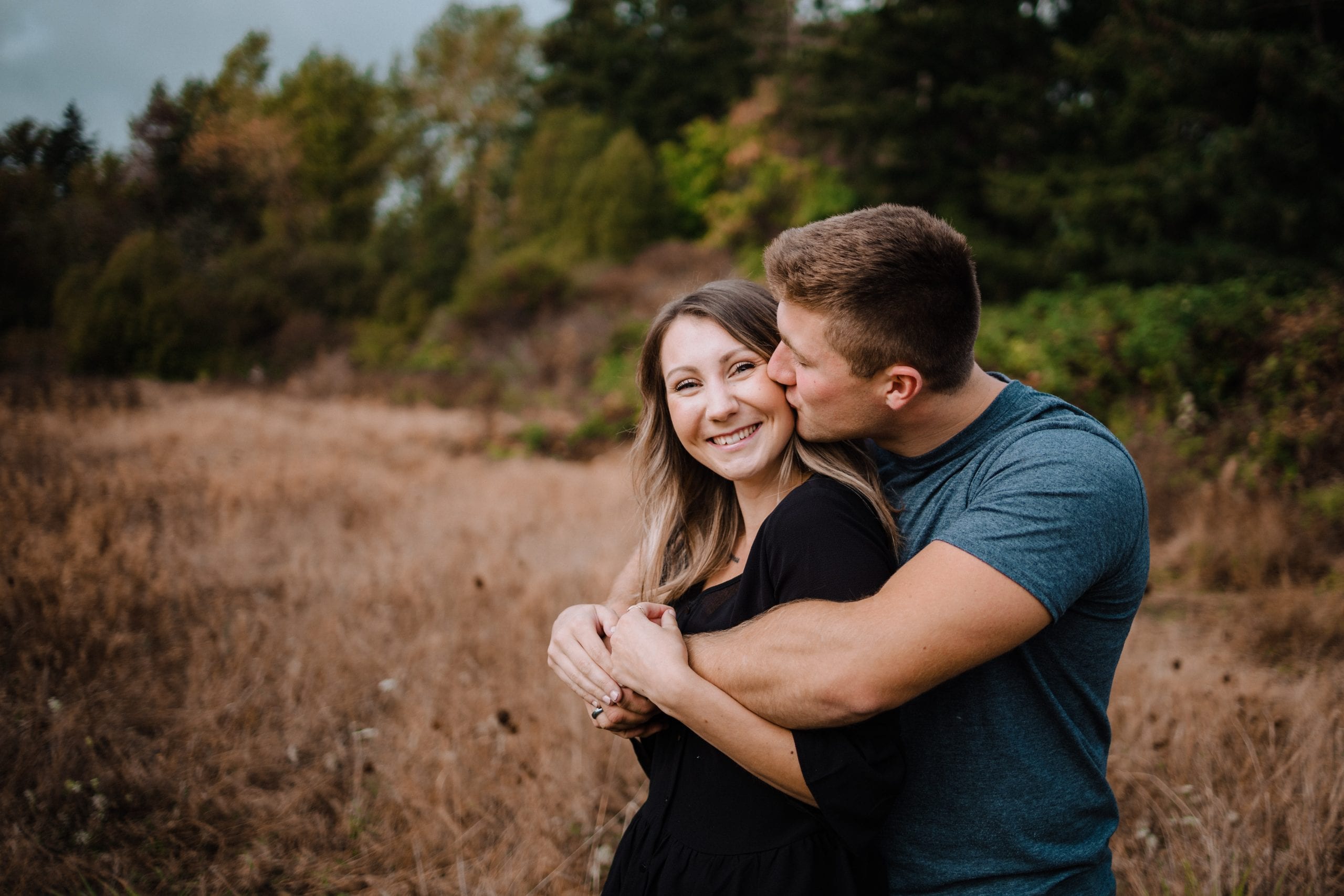Couple in field - elk lake couples session victoria bc