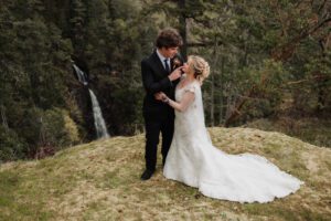 A couple after their elopement by a waterfall on Vancouver Island BC