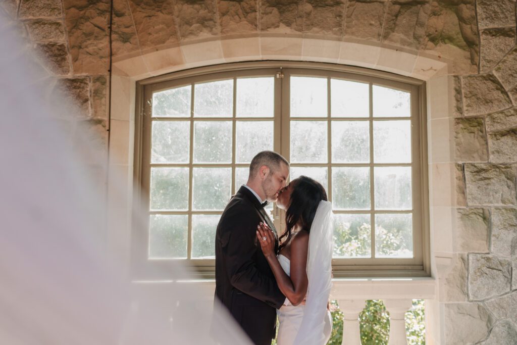 A couple kissing after Getting Married at Hatley Castle